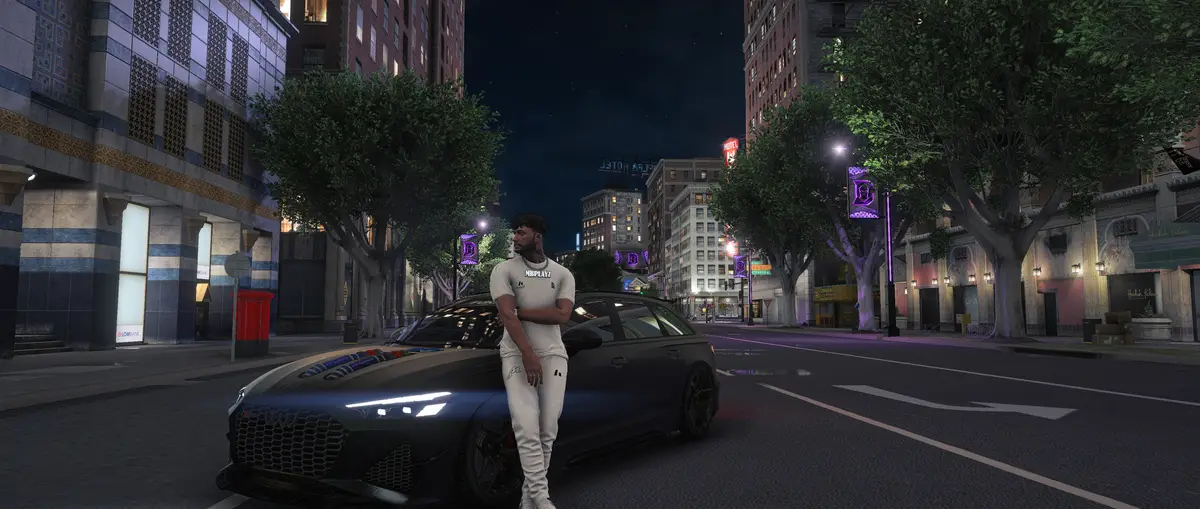 A new Drill UK resident leaning on a car under the city lights