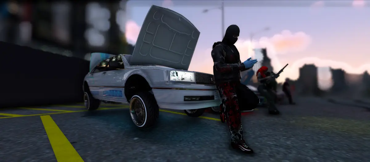 A masked Drill UK player standing beside a car with its bonnet raised at dusk